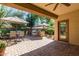 Outdoor patio with seating area, built-in grill, and umbrella at 2677 E Ficus Way, Gilbert, AZ 85298