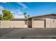 Rear view of the property, showing a private entrance and garage at 13447 W Copperstone Dr, Sun City West, AZ 85375