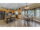 Eat-in kitchen with island, wood cabinets, and tile flooring at 7007 S Sipapu Ct, Gold Canyon, AZ 85118