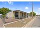 Single-wide manufactured home with covered porch at 535 S Alma School Rd # 83, Mesa, AZ 85210