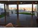 View of backyard oasis with paved patio, built-in grill, and putting green at 9987 W Verde Ln, Avondale, AZ 85392
