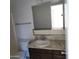 Bathroom features a vanity with a marble top and a large mirror at 11022 N 41St Ave, Phoenix, AZ 85029