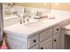 Bathroom boasts a white vanity with a quartz countertop and chrome fixtures at 12840 W Santa Ynez Dr, Sun City West, AZ 85375