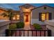 Welcoming front entrance with a stone facade, walkway, and landscaping at 12840 W Santa Ynez Dr, Sun City West, AZ 85375