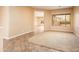 Spacious living room with carpeted flooring and large windows at 12840 W Santa Ynez Dr, Sun City West, AZ 85375