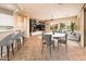 Open concept kitchen and living space with bar seating at 12840 W Santa Ynez Dr, Sun City West, AZ 85375