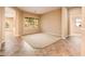 Open living area with carpeted floor and access to other rooms at 12840 W Santa Ynez Dr, Sun City West, AZ 85375