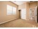 Well-lit bedroom with window and closet at 12840 W Santa Ynez Dr, Sun City West, AZ 85375