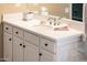 Bathroom vanity with white cabinets, quartz countertop, and modern chrome fixtures at 12840 W Santa Ynez Dr, Sun City West, AZ 85375