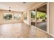 Open living room with sliding doors to backyard at 12840 W Santa Ynez Dr, Sun City West, AZ 85375