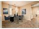 Dining room with a modern dining set and a chandelier at 12840 W Santa Ynez Dr, Sun City West, AZ 85375