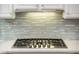 Gas cooktop with contemporary backsplash at 12840 W Santa Ynez Dr, Sun City West, AZ 85375