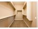 Large walk-in closet with ample shelving and hanging space at 12840 W Santa Ynez Dr, Sun City West, AZ 85375