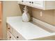 White quartz countertop with white cabinets at 12840 W Santa Ynez Dr, Sun City West, AZ 85375