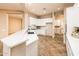 Updated kitchen, white cabinets, and tile floors at 12840 W Santa Ynez Dr, Sun City West, AZ 85375