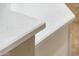 Close-up view of the kitchen's white quartz countertop edge detail at 12840 W Santa Ynez Dr, Sun City West, AZ 85375