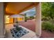 Covered patio with outdoor furniture and desert landscaping at 12840 W Santa Ynez Dr, Sun City West, AZ 85375