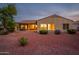 Backyard patio and gravel landscaping at sunset at 12840 W Santa Ynez Dr, Sun City West, AZ 85375