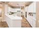 Modern kitchen with white cabinets and quartz countertops at 12840 W Santa Ynez Dr, Sun City West, AZ 85375