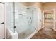 Large walk-in shower with glass enclosure and marble tile at 12840 W Santa Ynez Dr, Sun City West, AZ 85375