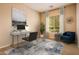 Home office featuring a desk, chair, and neutral decor at 12840 W Santa Ynez Dr, Sun City West, AZ 85375