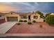 One-story house with two car garage and desert landscaping at 12840 W Santa Ynez Dr, Sun City West, AZ 85375