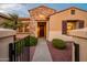 View of the home's entryway with a gate and pathway at 12840 W Santa Ynez Dr, Sun City West, AZ 85375