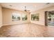 Sunlit living room with access to backyard patio at 12840 W Santa Ynez Dr, Sun City West, AZ 85375