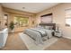 Spacious Primary bedroom with large windows and neutral decor at 12840 W Santa Ynez Dr, Sun City West, AZ 85375