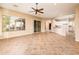 Living room with kitchen views and tile floors at 12840 W Santa Ynez Dr, Sun City West, AZ 85375