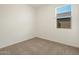 Bright bedroom featuring neutral wall and carpeting at 2644 E Rosario Mission Dr, Casa Grande, AZ 85194