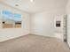 Bedroom with carpet flooring and access to another room at 2644 E Rosario Mission Dr, Casa Grande, AZ 85194