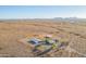 Aerial view of a house on a large desert lot with distant mountains at 35203 W Indian School Rd, Tonopah, AZ 85354