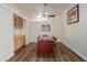 Bright dining room features wood flooring and a built-in cabinet at 35203 W Indian School Rd, Tonopah, AZ 85354