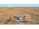 Aerial view of a house with large lot, additional buildings and open desert at 35203 W Indian School Rd, Tonopah, AZ 85354