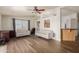 Bright living room with hardwood floors and two sofas at 35203 W Indian School Rd, Tonopah, AZ 85354