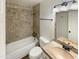 Bathroom with a tiled shower and a mosaic countertop at 17839 N 43Rd St, Phoenix, AZ 85032