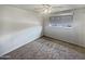 Spacious bedroom with ceiling fan and neutral carpeting at 4026 W Rovey Ave, Phoenix, AZ 85019