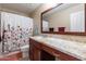 Bathroom with granite vanity and floral shower curtain at 40350 W Art Pl, Maricopa, AZ 85138