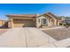 One-story home with green shutters and gravel landscaping at 40350 W Art Pl, Maricopa, AZ 85138