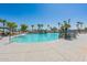 Relaxing community pool with surrounding landscaping at 40350 W Art Pl, Maricopa, AZ 85138