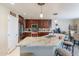 Spacious kitchen with granite island and stainless steel appliances at 40350 W Art Pl, Maricopa, AZ 85138