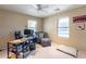 Bedroom with a comfortable sitting area and large window at 40350 W Art Pl, Maricopa, AZ 85138