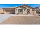 One-story home with green shutters and gravel landscaping at 40350 W Art Pl, Maricopa, AZ 85138