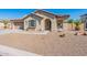 One-story home with green shutters and gravel landscaping at 40350 W Art Pl, Maricopa, AZ 85138