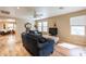 Spacious living room with hardwood floors and ample natural light at 40350 W Art Pl, Maricopa, AZ 85138