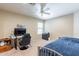 Bedroom with a desk, chair, and bed, suitable for a home office at 40350 W Art Pl, Maricopa, AZ 85138