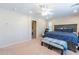 Spacious Primary bedroom with ensuite bathroom access and ceiling fan at 40350 W Art Pl, Maricopa, AZ 85138