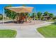 Community playground with play structures and shaded seating at 40350 W Art Pl, Maricopa, AZ 85138