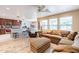 Open kitchen with granite countertops and island bar at 40350 W Art Pl, Maricopa, AZ 85138